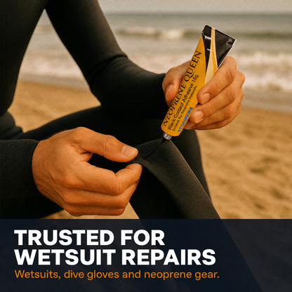 A person in a black wetsuit applies a tube of Neoprene Queen Black Contact  Adhesive to a seam on a black wetsuit or diving glove, set against a blurred beach background. A dark blue banner at the bottom reads 'TRUSTED FOR WETSUIT REPAIRS' with 'Wetsuits, dive gloves and neoprene gear.